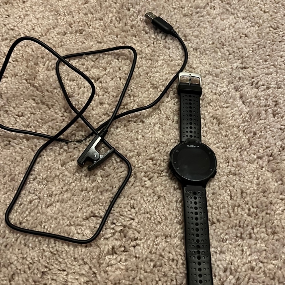 Forerunner 235 used, still has a lot of life. With charging cord